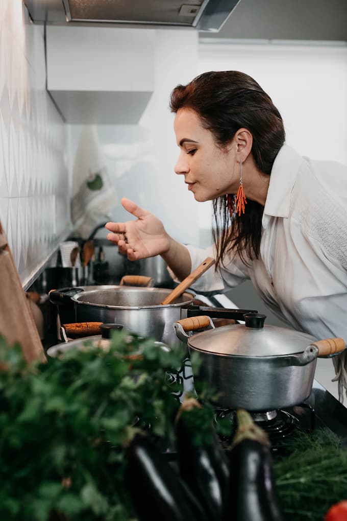 Woman cooking a healthy meal in a bright kitchen